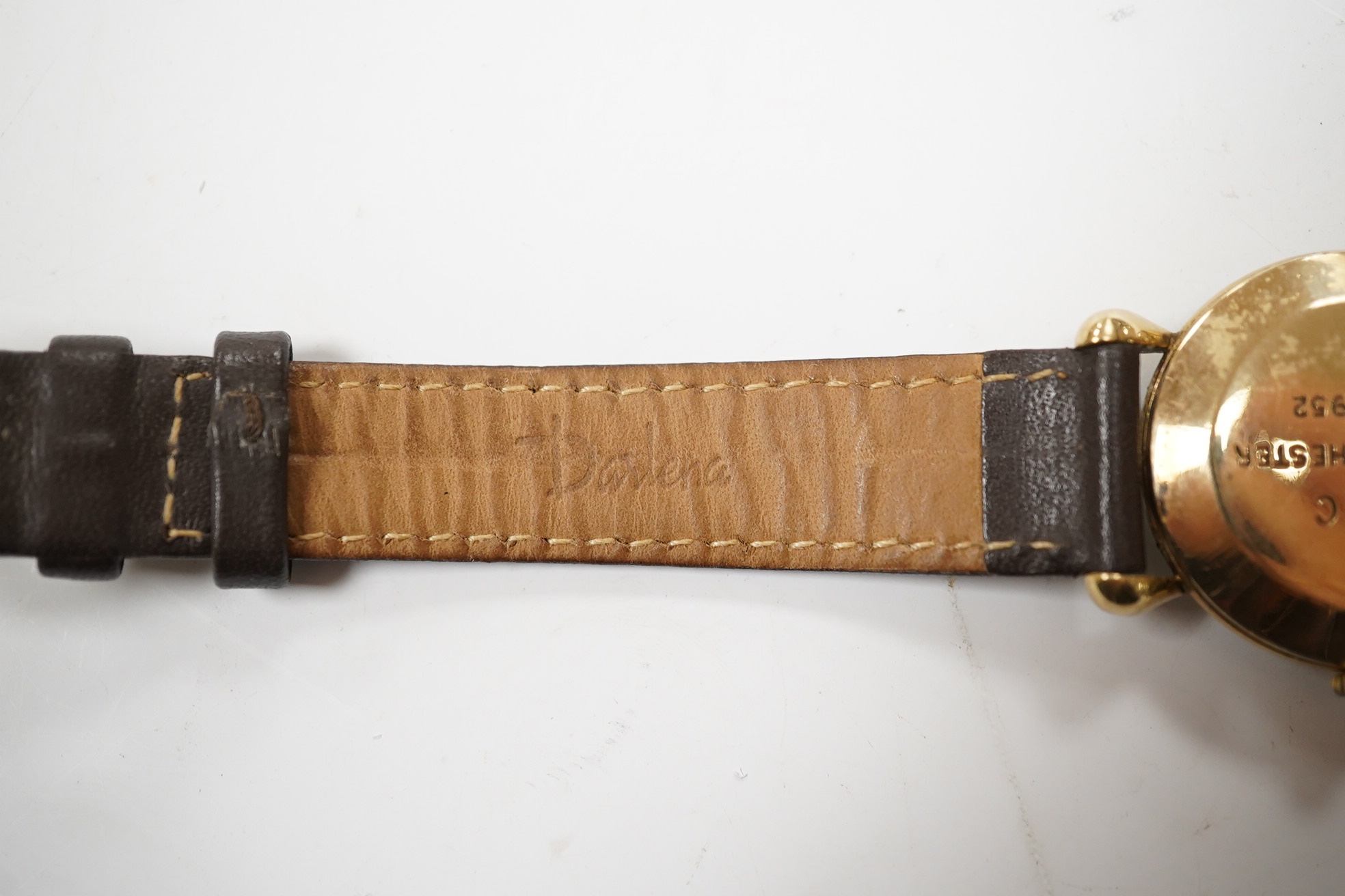 A gentleman's 9ct Uno manual wind wrist watch, with Arabic and dot numerals, with subsidiary seconds, case diameter 29mm, on a leather strap. Condition - poor.